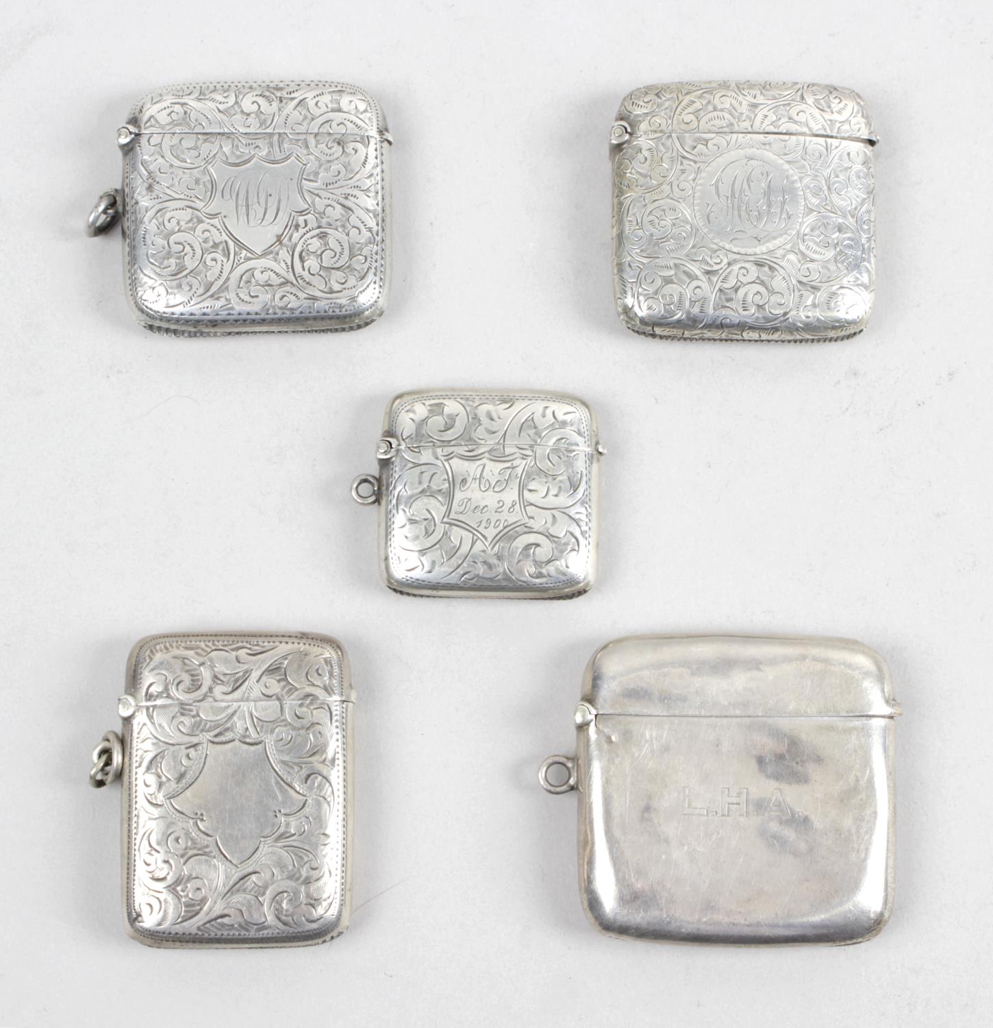 Four Edwardian silver vesta cases,