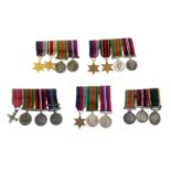 WWII, two mounted miniature medal groups of four,