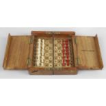 An early 20th century mahogany Jaques of London travel chess set,