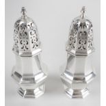 A pair of late Victorian silver pepper casters,