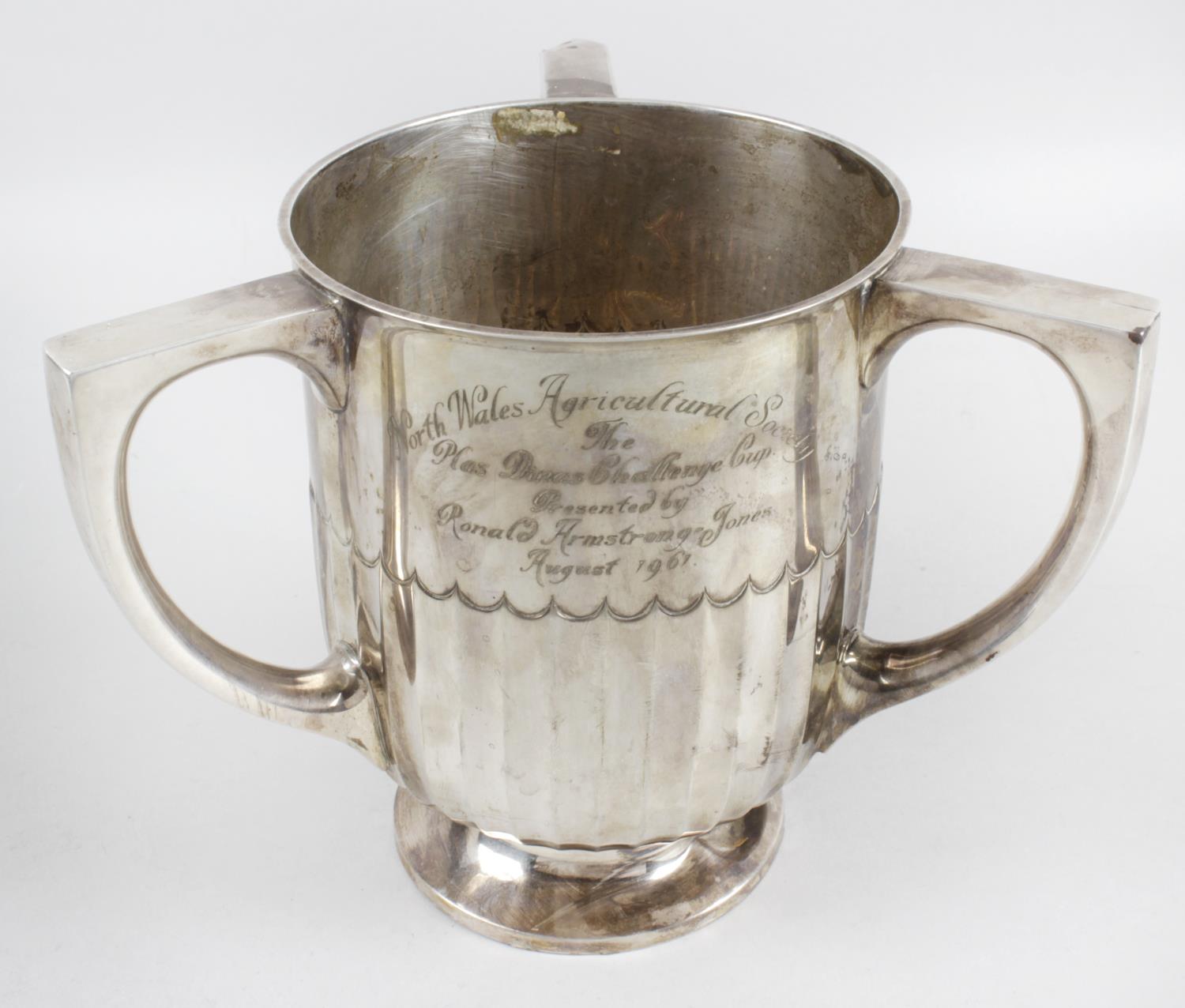 A late nineteenth century silver three-handled cup,