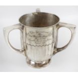 A late nineteenth century silver three-handled cup,