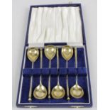 A cased set of six late nineteenth century Russian silver-gilt spoons,