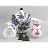 A 19th century pottery jug with frilled collar and looped handle,