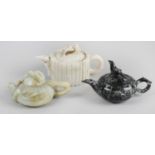 Three 20th century Oriental carved hardstone teapots and covers,