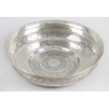 An Eastern white metal shallow bowl,
