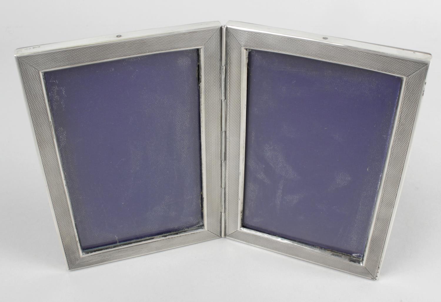 A continental silver mounted double photograph frame,