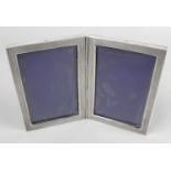 A continental silver mounted double photograph frame,