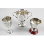 Three silver trophies,