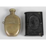 A late 19th century novelty base metal vesta case modelled a spirit flask,