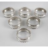 A set of six late Victorian silver napkin rings,