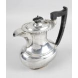 A 1930's silver hot water pot,