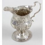 A George III silver pedestal cream jug,