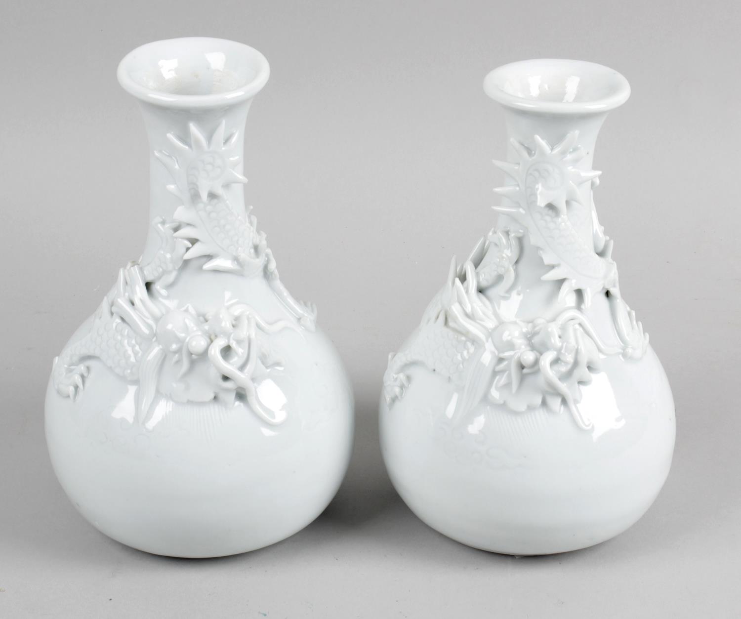 A pair of late 19th century Chinese Blanc de Chine glazed vases,