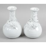 A pair of late 19th century Chinese Blanc de Chine glazed vases,