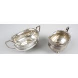 A 1930's silver twin-handled sugar bowl and matching cream jug,
