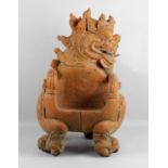 A unusual small Oriental painted and carved hardwood dragon chair or throne,