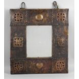 An Arts and Crafts copper framed mirror,