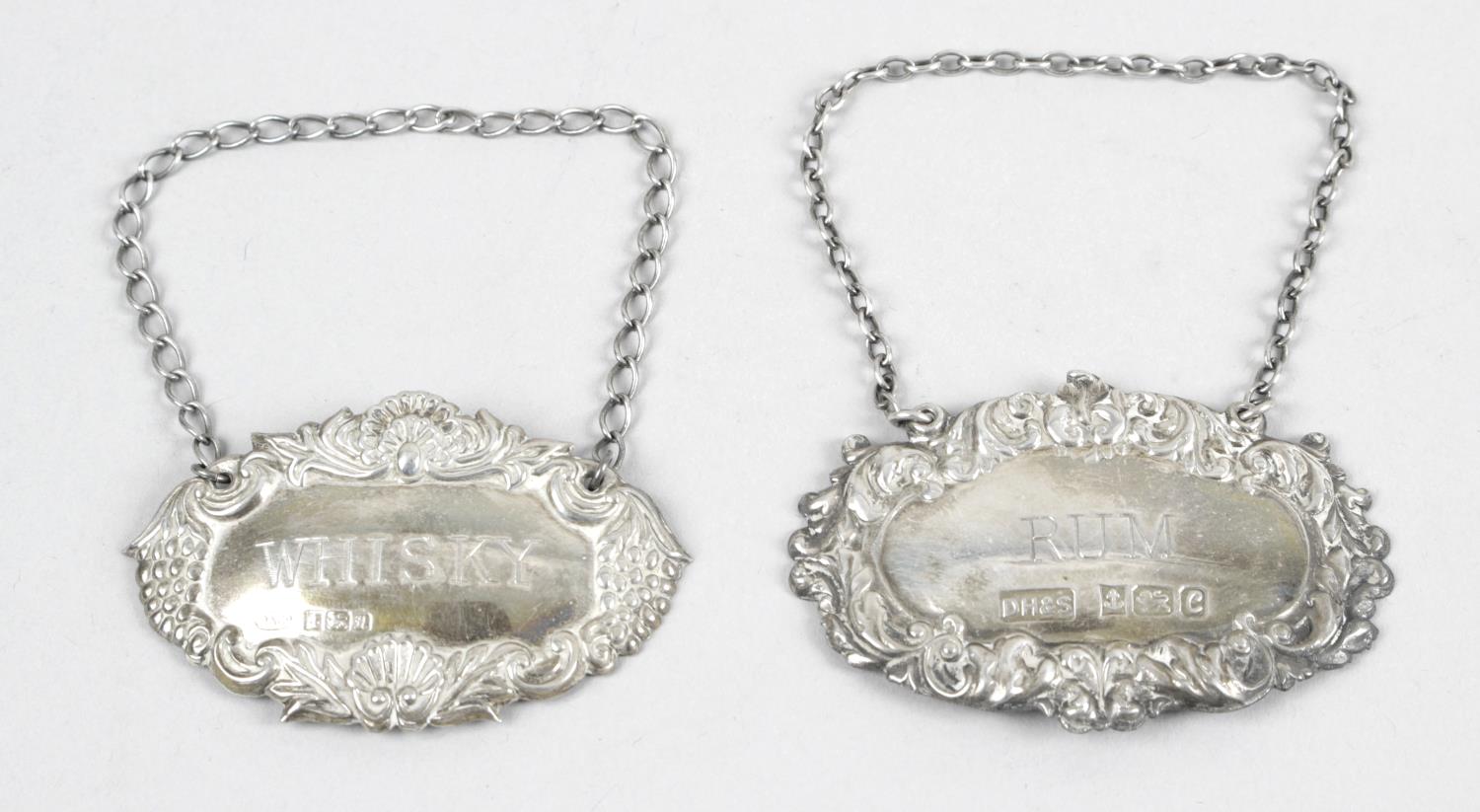 Two modern silver decanter labels,