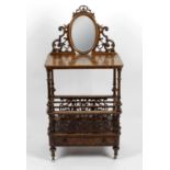 A Victorian walnut veneered mirror back whatnot,