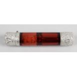 A ruby glass double-ended scent bottle of cylindrical form,