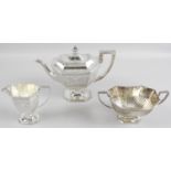 A late Victorian silver three piece tea service,