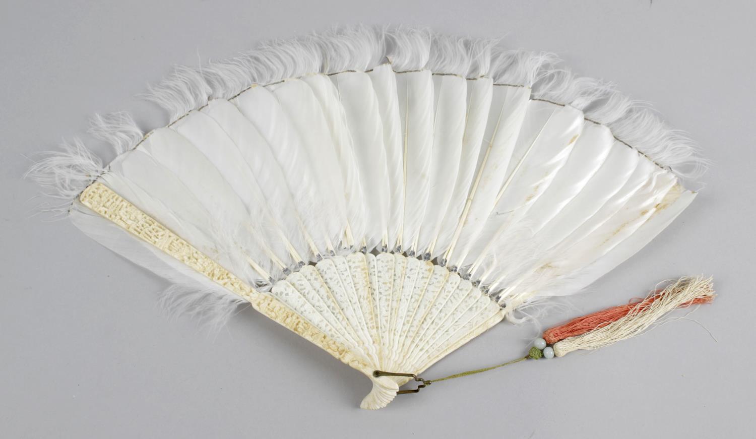 A 19th century Oriental ivory and feather hand held fan,