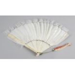 A 19th century Oriental ivory and feather hand held fan,