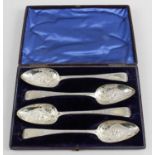 A cased set of four late George III silver-gilt 'berry' spoons,