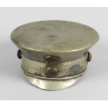 A novelty base metal snuff box and cover modelled as an Army Officers peaked cap,