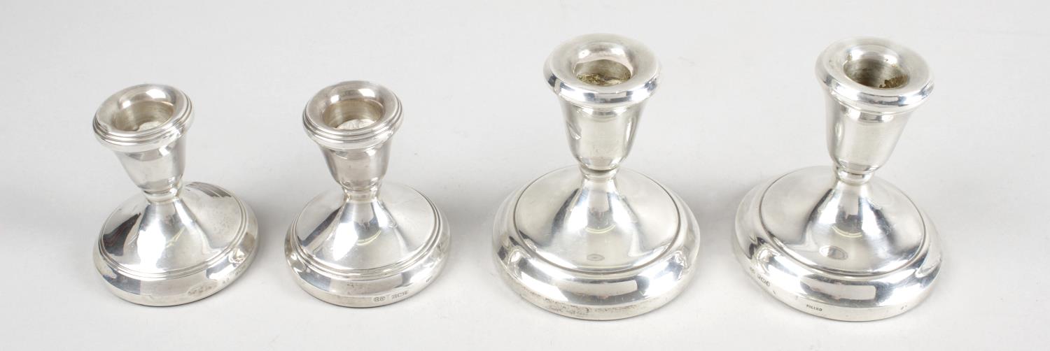 A pair of modern silver mounted dwarf candlesticks,