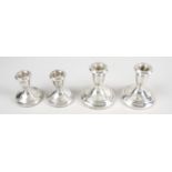 A pair of modern silver mounted dwarf candlesticks,