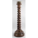 A 19th century ecclesiastical turned oak altar candlestick,