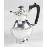 A 1930's silver hot water pot,