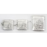 Three silver vesta cases,