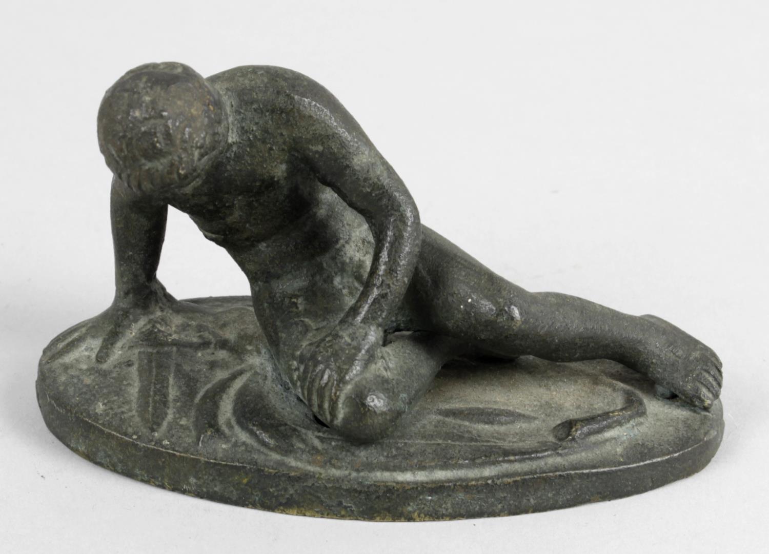 A 19th century Grand Tour souvenir bronze, modelled as The Dying Gaul, 4.5 (11.5cm) wide.