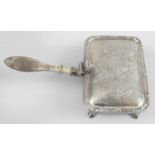 A mid-twentieth century small silver cheese toasting dish,