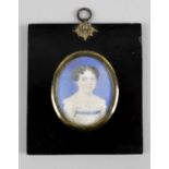 A 19th century oval painted portrait miniature on ivory,