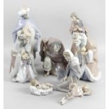 A composed Lladro and Nao eight piece nativity set,