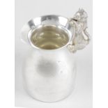 A modern plain silver cream jug,