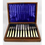 A cased set of Edwardian silver and ivory-handled fish knives and forks for six place settings,