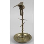 A small bronze jewellery stand modelled as a parrot upon a perch of tall slender form,