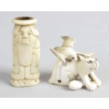 A 19th century ivory netsuke modelled as cat with inset glass eyes,