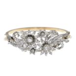 A paste and cultured pearl floral hinged bangle.Inner diameter 5.8cms.