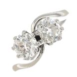 A platinum old-cut diamond two-stone ring.Diamond weights 0.88ct and 0.89ct respectively,