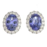 A pair of sapphire and diamond cluster earrings.Total sapphire weight 1.95cts.