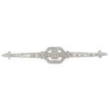 An 18ct gold diamond bar brooch.Estimated total diamond weight 0.60ct,