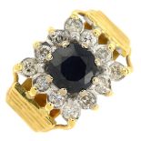 A 1970s 18ct gold sapphire and diamond cluster ring.Estimated total diamond weight 0.40ct.Hallmarks