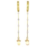 A pair of 18ct gold diamond and yellow sapphire drop earrings.Total diamond weight 0.20ct,