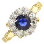 An 18ct gold sapphire and diamond cluster ring.Estimated total diamond weight 0.40ct.Hallmarks for